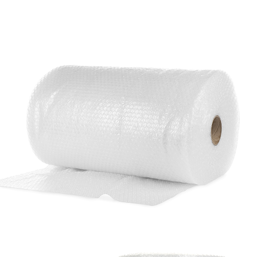 Large roll of clear bubble wrap unravelling. Ideal for protectively wrapping breakable items. 